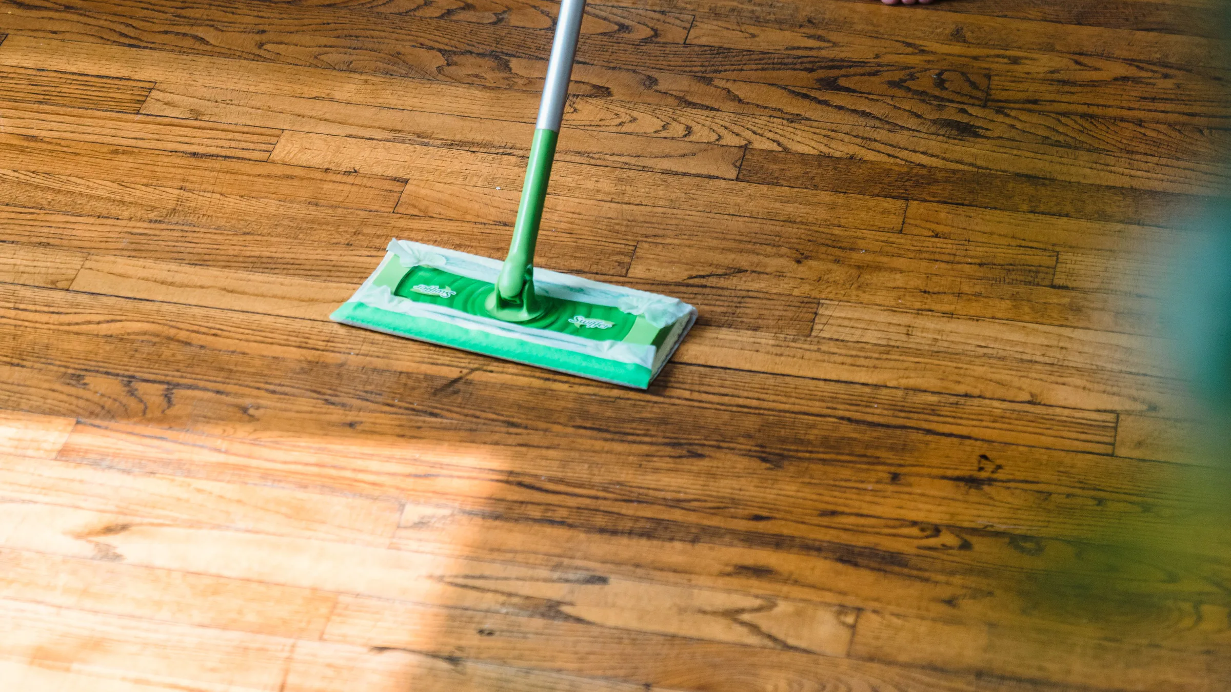 Contractor installing new flooring during a home remodel